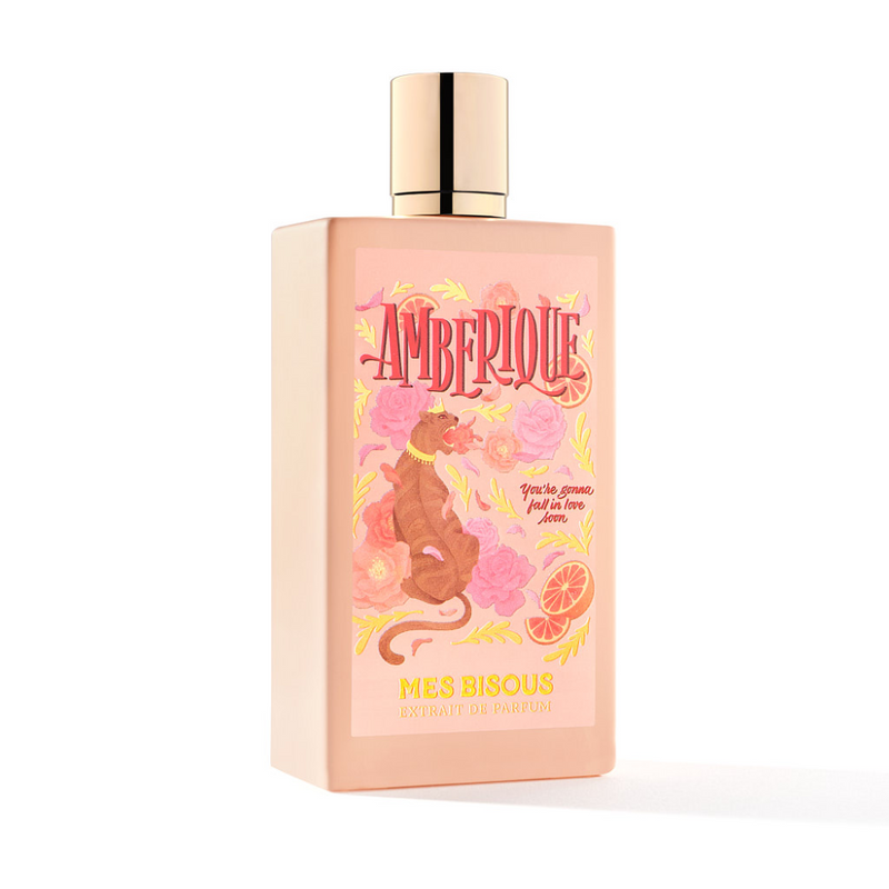 Amberique Mes Bisous 3.4 oz perfume bottle with elegant amber-colored liquid and floral accents on the label.