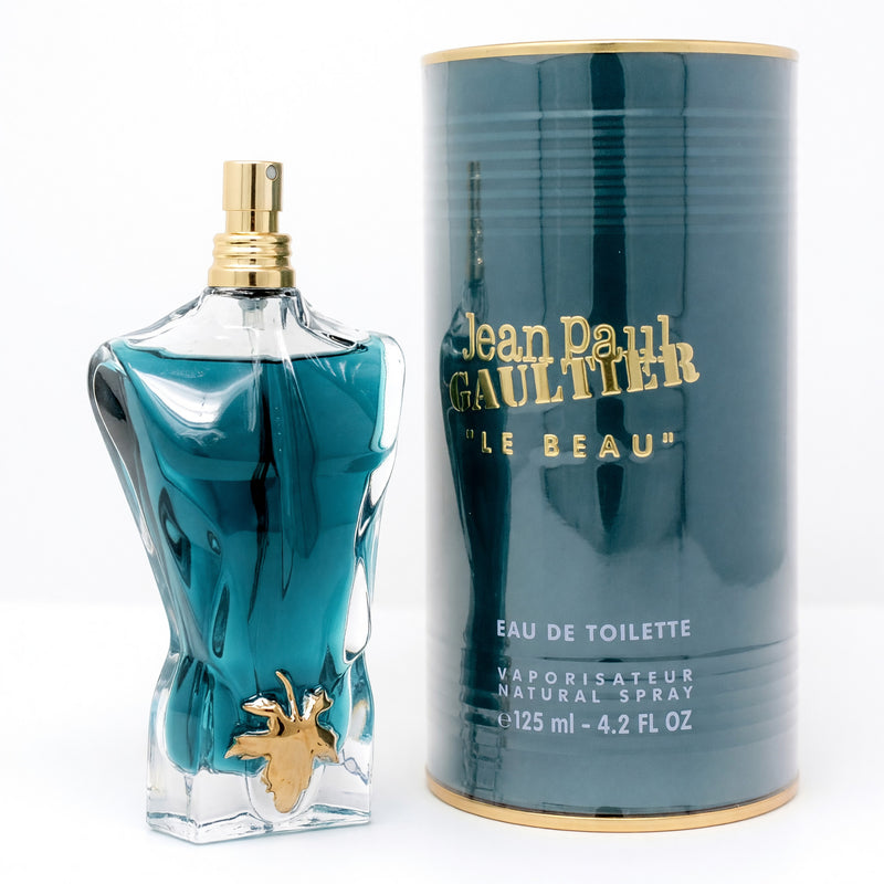 Jean Paul Gaultier Le Beau men's 4.2 oz EDT spray bottle with sleek design and masculine branding, displayed on a neutral background.