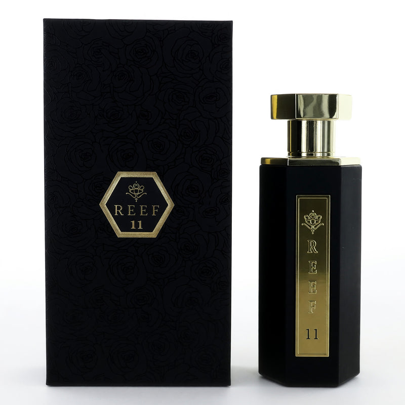 Reef 11 by Reef Perfumes 3.4 oz men's parfum spray, elegant bottle with sleek design and gold accents.