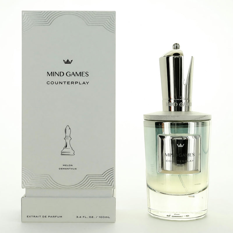 Counterplay by Mind Games unisex 3.4 oz extrait de parfum spray bottle, sleek design and elegant packaging visible in the image.