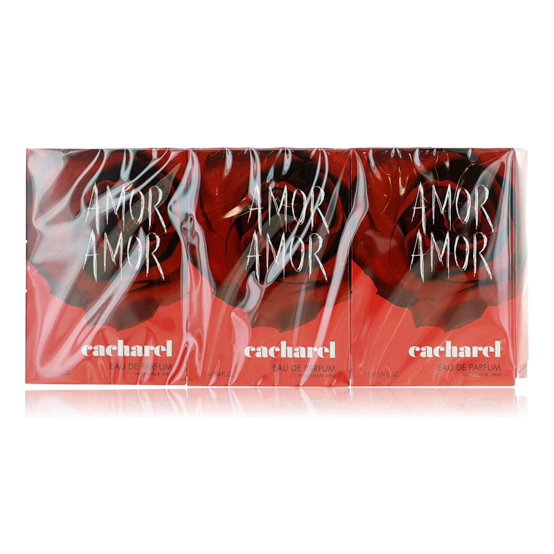 Set of 12 Cacharel Amor Amor women’s 0.04oz EDP spray bottles, compact perfume packs displayed in the image.