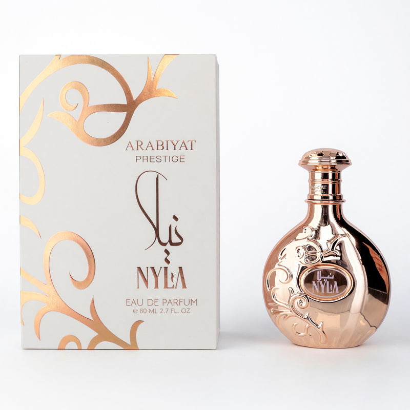 Arabiyat Prestige Nyla women's 2.7 oz EDP spray featuring elegant floral and citrus notes in a sleek bottle.