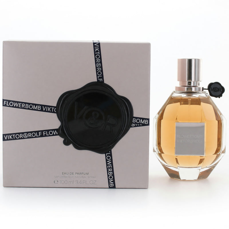 Viktor & Rolf Flowerbomb 3.4 oz women's Eau de Parfum spray bottle with floral packaging and elegant design.