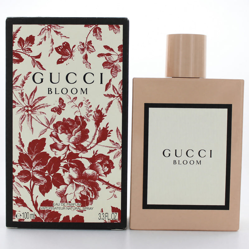 Gucci Bloom women's 3.3 oz Eau de Parfum spray bottle with floral design and Gucci branding.