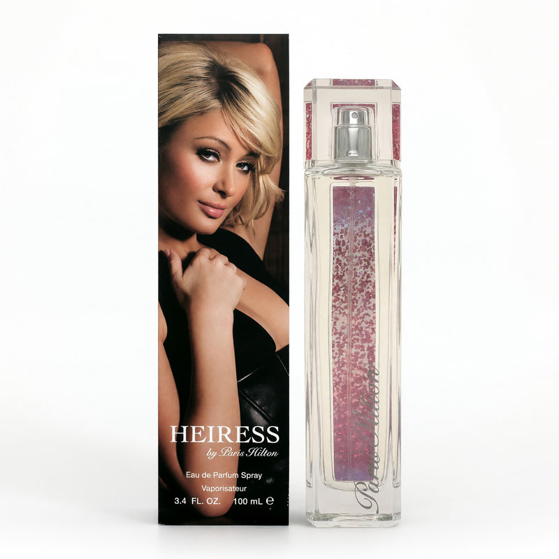 Paris Hilton Heiress 3.4 oz EDP spray for women, elegant glass bottle with gold accents, showcasing the luxurious perfume.