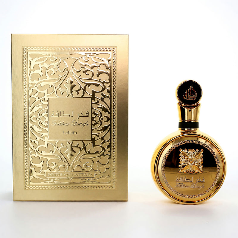 Fakhar Gold by Lattafa unisex 3.4 oz EDP spray bottle, elegant design with golden accents, showcasing the perfume packaging.