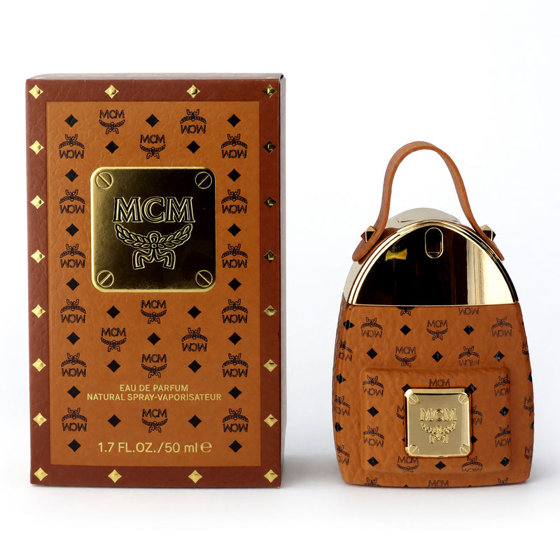 MCM by MCM 1.7 oz women's eau de parfum spray bottle with elegant design and branding visible.