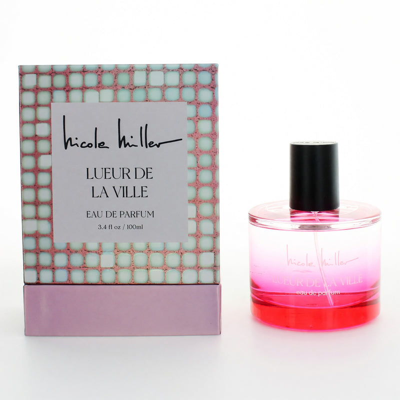 Nicole Miller Lueur De La Ville 3.4 oz women's EDP spray bottle, elegant fragrance with a sleek design.