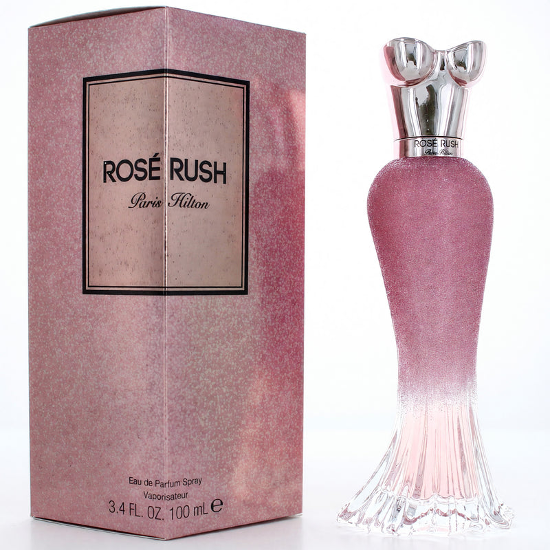 Paris Hilton Rose Rush 3.4 oz women's EDP spray bottle, featuring floral pink packaging with the perfume spray nozzle visible.