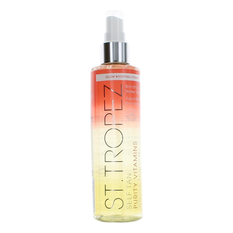 St. Tropez Self Tan Purity Vitamins Bronzing Water Mist for women, 6.7 oz, with a clear spray bottle and golden liquid inside.