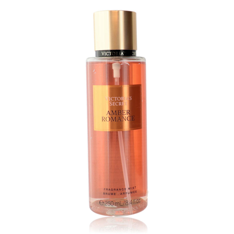 Victoria's Secret Amber Romance fragrance mist for women, 8.4 oz bottle with amber-colored liquid and elegant packaging.