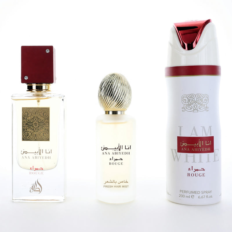 Ana Abiyedh Rouge by Lattafa unisex perfume gift set with three bottles of fragrance in elegant packaging.