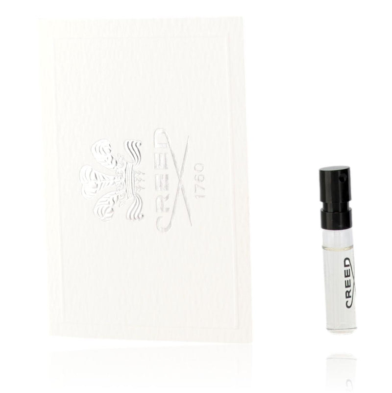 Small bottle of Green Irish Tweed Creed men's eau de parfum spray, 0.05 oz, with green label and silver cap.