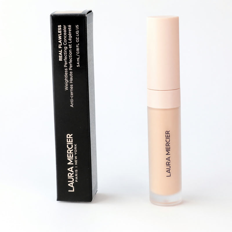 Laura Mercier Real Flawless Weightless Perfecting Concealer 0W1, physical product in a small jar with a beige shade.