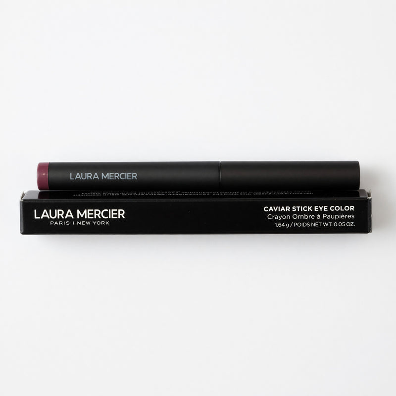 Laura Mercier Caviar Stick Eye Color in Dusk, 0.05oz eyeshadow stick with a shimmering dusk shade, displayed on a neutral background.
