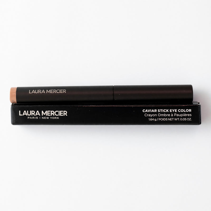 Laura Mercier Caviar Stick Eye Color in Caramel, a creamy eyeshadow stick with a smooth, blendable caramel shade.