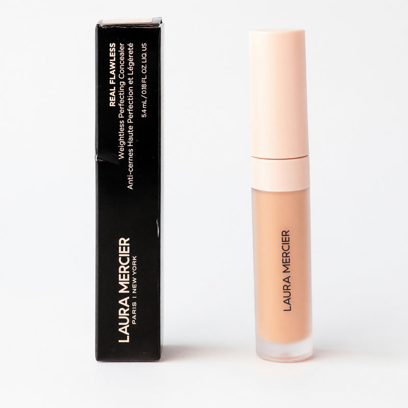 Laura Mercier Real Flawless Weightless Perfecting Concealer in shade 2N1, physical product with applicator and sleek packaging.