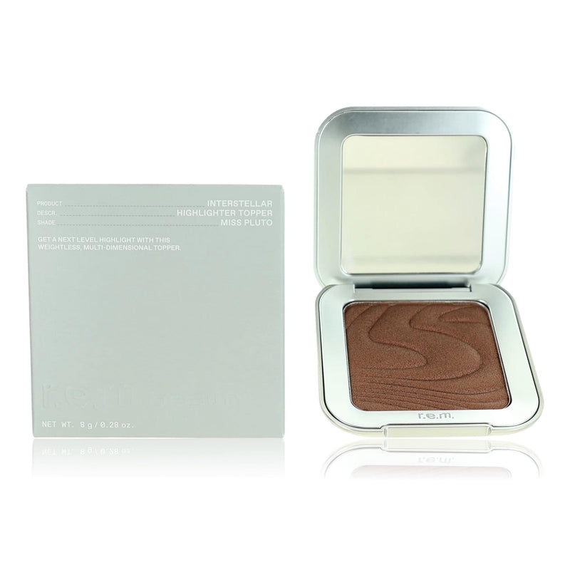 r.e.m. beauty Interstellar Miss Pluto highlighter topper in .28 oz, shimmering cosmetic product with cosmic design visible in the image