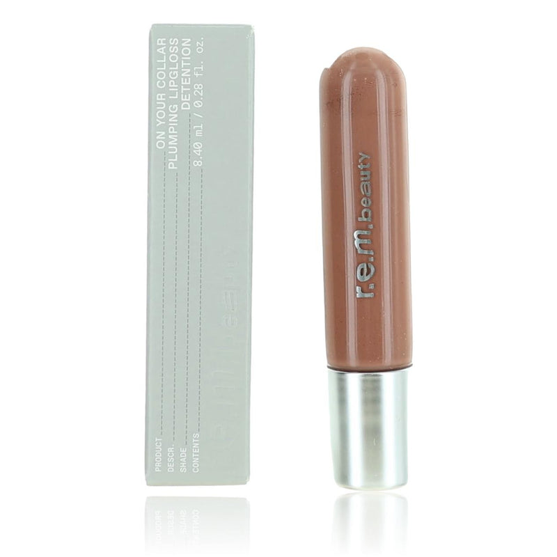 r.e.m. beauty On Your Collar plumping lipgloss in Detention, 0.28 oz, showing the clear tube with glossy lip gloss inside.