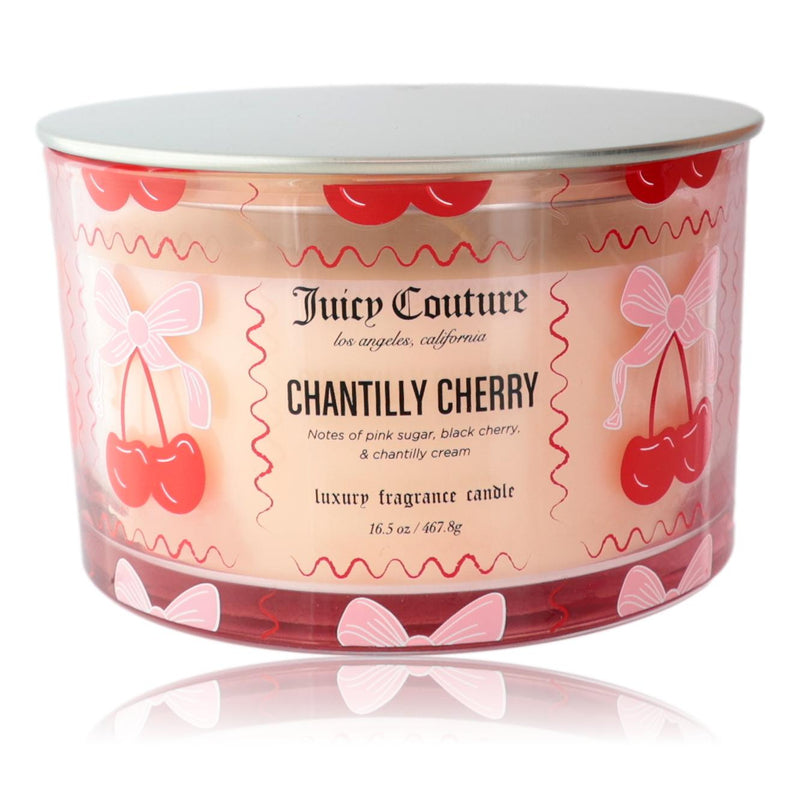 Juicy Couture Chantilly Cherry soy wax blend 3-wick candle in a glass jar, 16.5 oz, with a decorative label and lit wicks.