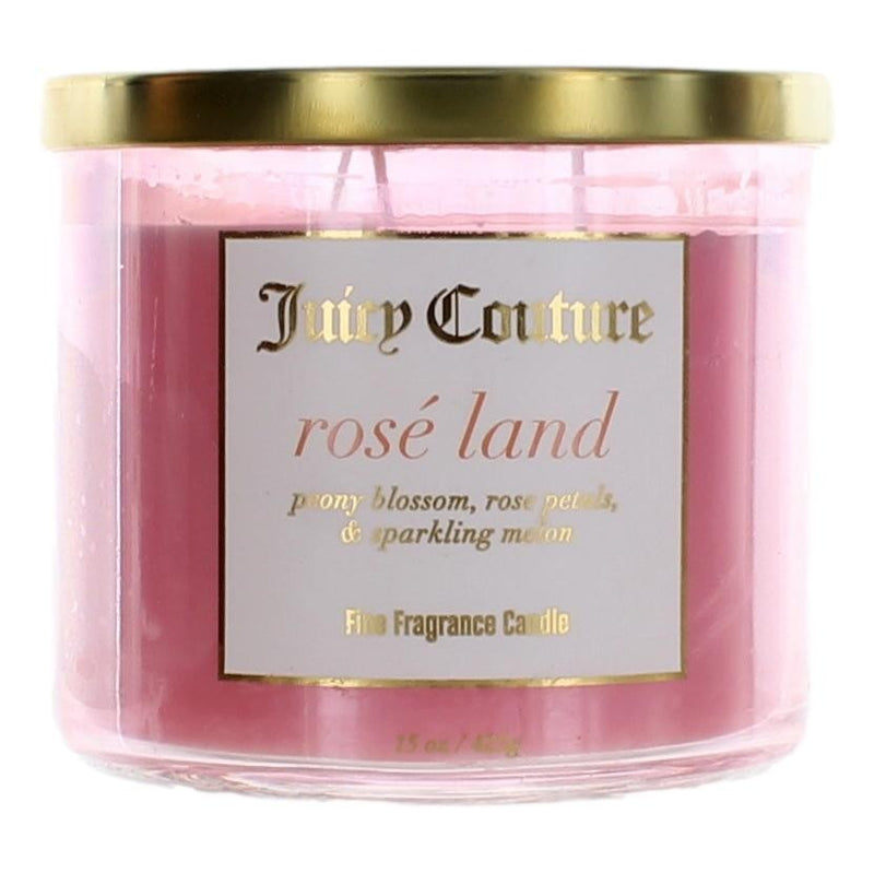 Juicy Couture 14.5 oz soy wax blend three-wick candle with rose scent in a decorative jar.