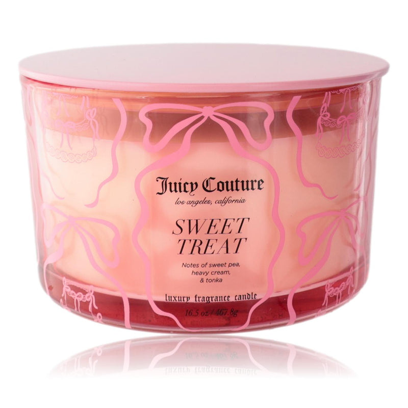 Juicy Couture 16.5 oz soy wax blend three-wick candle with sweet treat scent, featuring a decorative jar design.