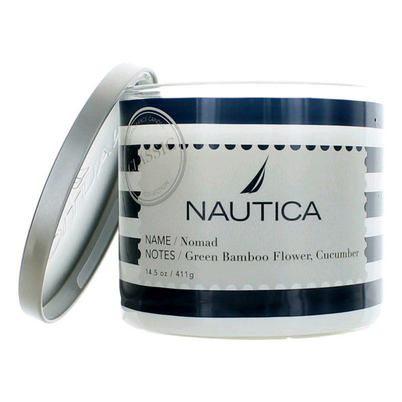Nautica Nomad soy wax blend 3-wick candle in a glass jar, showcasing a sleek design and warm candlelight.