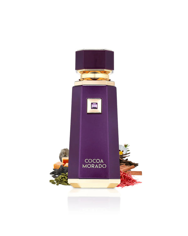 French Avenue Cocoa Morado perfume bottle by Pertinacia Perfume surrounded by saffron and cardamom on a white background.