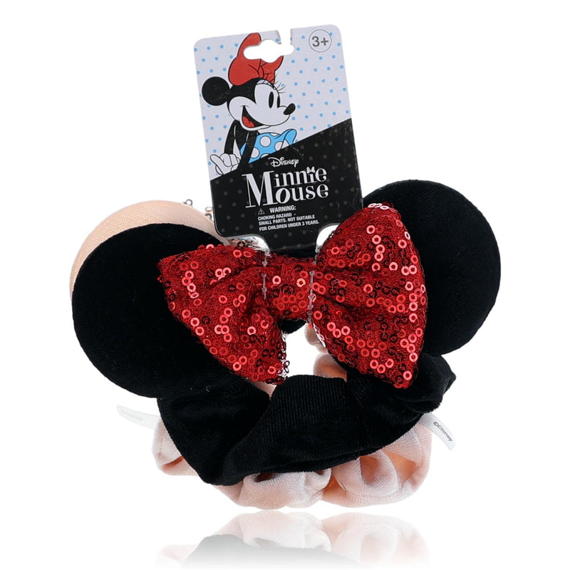 Two Disney Minnie Mouse hair scrunchies for kids featuring Minnie Mouse and polka dot patterns, perfect for young children.