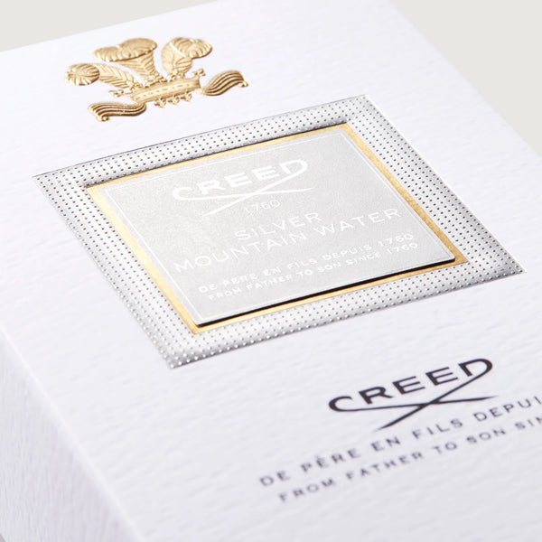 Silver Mountain Water Creed perfume 3.3 oz EDP bottle, featuring sleek silver packaging and elegant fragrance display.