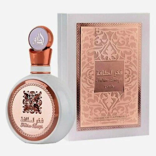 Fakhar by Lattafa Eau De Parfum Spray for Women, 3.4 oz, featuring elegant perfume bottle with gold accents and floral design.