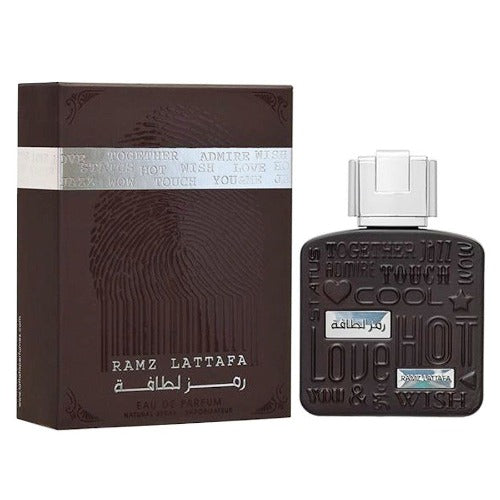 Lattafa Ramz Silver Eau De Parfum 3.4oz unisex bottle by Pertinacia LLC, featuring sleek silver packaging and elegant design.