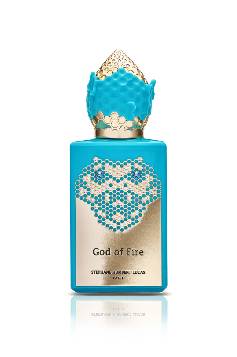 Perfume bottle of God of Fire by Stephane Humbert Lucas 777 from Pertinacia Perfume, with fiery design and elegant glass packaging.